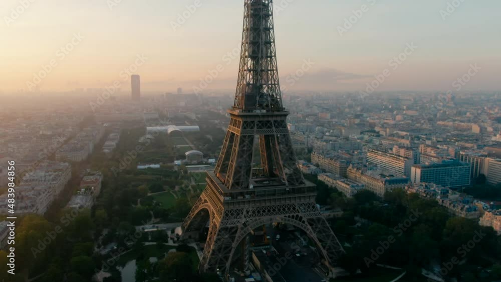 Aerial view of Paris Cityscape with Eiffel Tower as main Landmark Monument and Cultural Icon of Capital of France and Famous Touristic Destination. Travel and Urban Skyline Panorama. 4K drone shot
