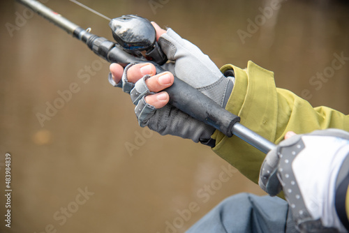 Man Holding Rod and Reel