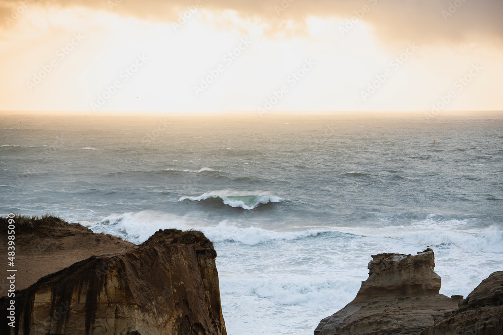 Stormy ocean waves during sunset in coastal Oregon