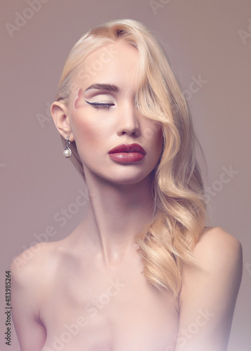 beautiful blond girl with heart on her face. Valentines day makeup