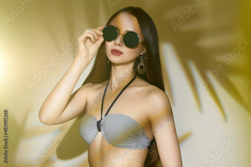 ummer girl in sunglasses and swimsuit