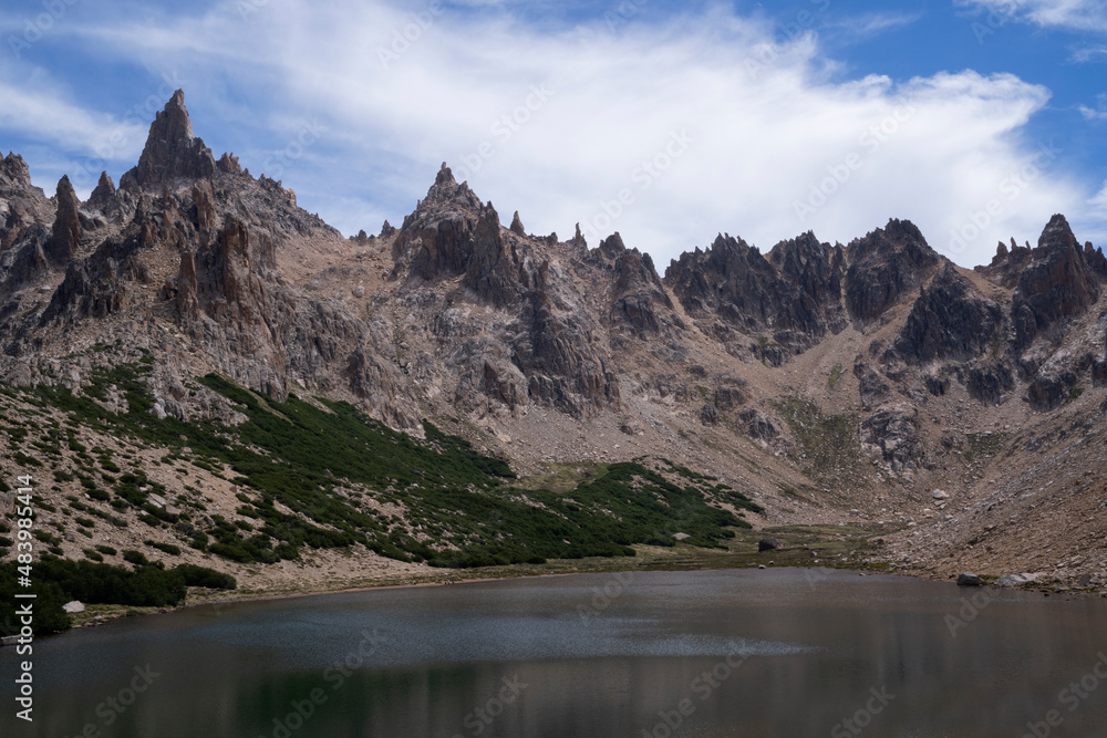 Alpine landscape. View of Toncek lake at the top of Catedral hill in Bariloche. The rocky mountains in the background. Alpine landscape. View of Toncek lake at the top of Catedral hill in Bariloche. The rocky mountains in the background.