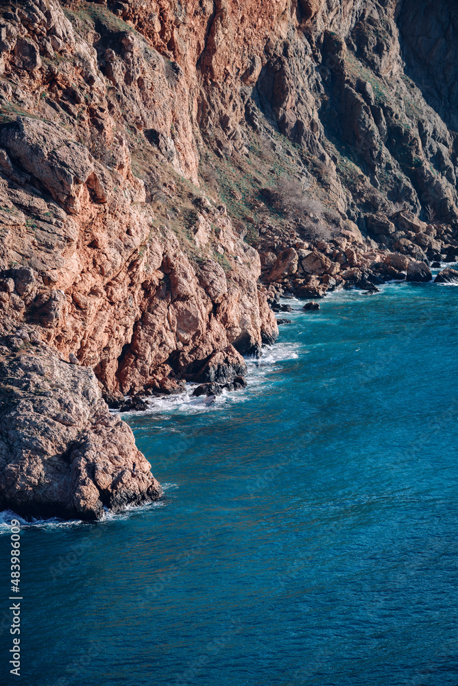 Obraz premium Landscape sea and rocks. The sea is an amazing blue color with different shades.