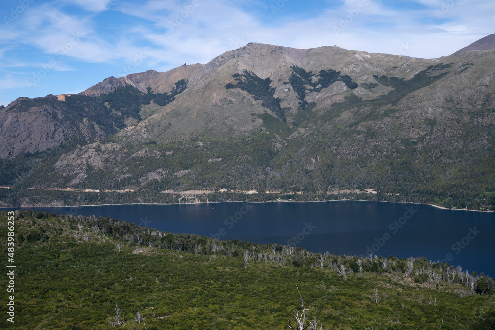 Fototapeta premium View of the forest, blue water Gutierrez lake and Catedral hill in Bariloche, Patagonia Argentina.