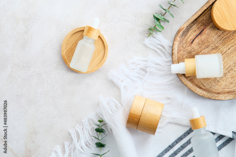 Cosmetic containers with green eucalyptus leaves on marble desk. Natural organic beauty products set. Cosmetic containers with green eucalyptus leaves on marble desk. Natural organic beauty products set.