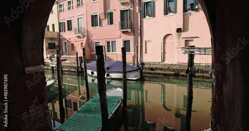 Chioggia town in venetian lagoon, water canal. Chioggia is a seaside town south of Venice, Italy. Traversed by the Corso del Popolo thoroughfare, its historic area has canals and narrow alleys.