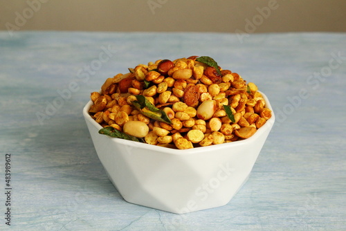 indian gujarati traditional dal mix bhel chivda chavanu snack in bowl photo