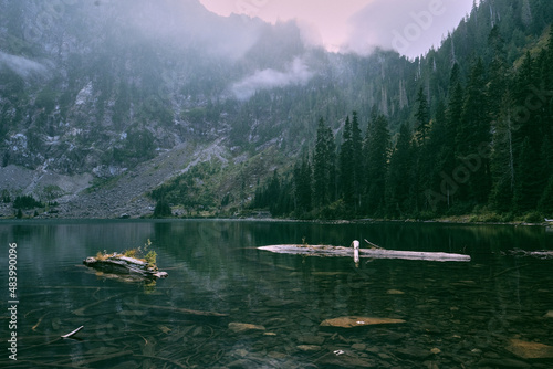 Lake 22 with low clouds rising into the mountains. photo