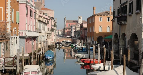 Chioggia town in venetian lagoon, water canal. Chioggia is a seaside town south of Venice, Italy. Traversed by the Corso del Popolo thoroughfare, its historic area has canals and narrow alleys.