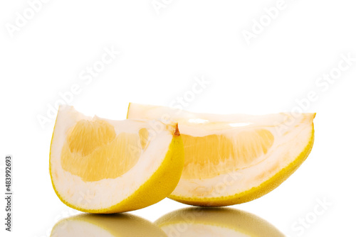 Two slices sweet pomelo, macro, isolated on white.