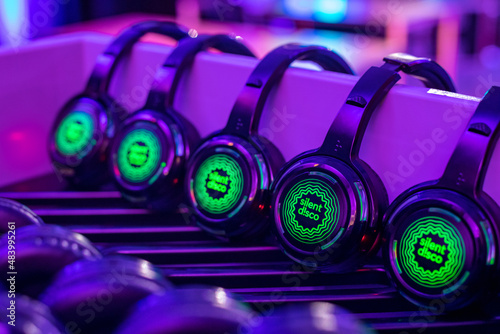 Green Silent Disco Headphones aligned at an event  photo