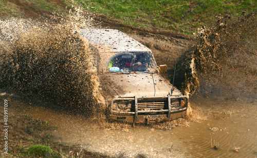 Offroad car in muddy water