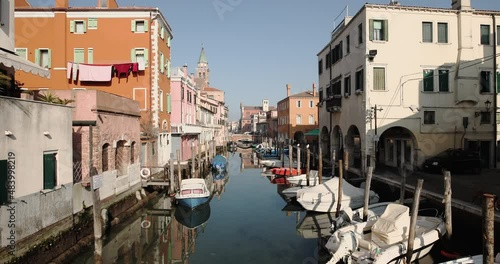 Chioggia town in venetian lagoon, water canal. Chioggia is a seaside town south of Venice, Italy. Traversed by the Corso del Popolo thoroughfare, its historic area has canals and narrow alleys.