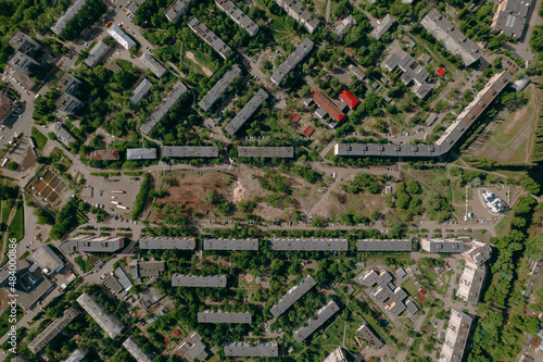 Aerial survey of the construction of a public garden in a residential area, top-down view