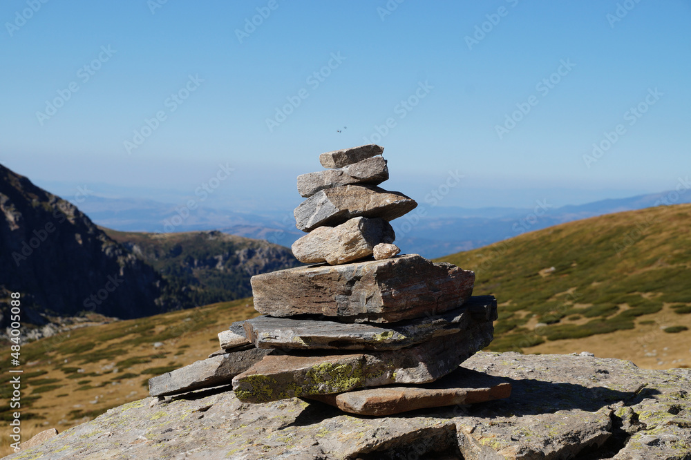 Buddhist cairn in the background of a mountain landscape Buddhist cairn in the background of a mountain landscape