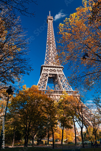 Autumn view to Eiffel Tower in Paris, with amazing colours and blue sky. Travel in France. © Dragoș Asaftei