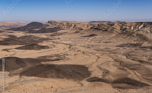 View of Ramon Crater from West to East as seen from Mount Ramon  a 500 m deep  the world s largest erosion cirque   located in the Negev Desert  south of Beer Sheba  Israel.     