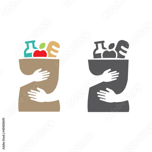 Two hands embrace a shopping bag