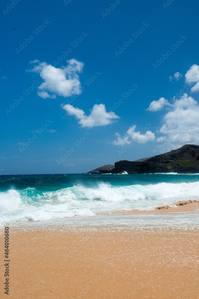 beach with sky and clouds and rocks in Hawaii