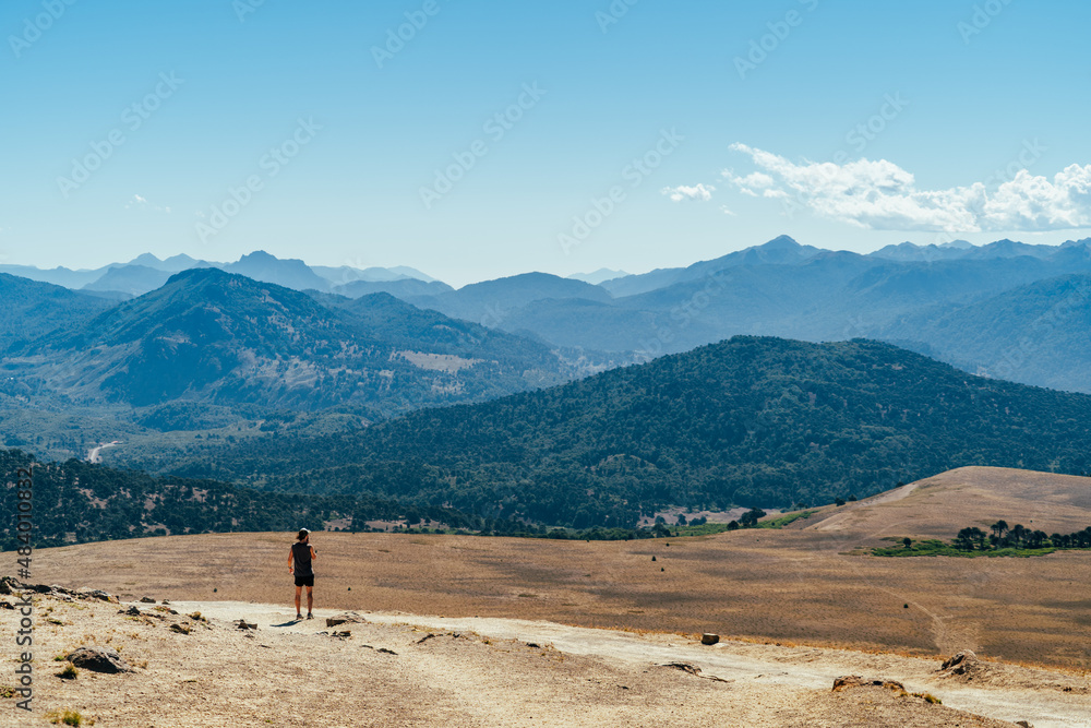 hiker and landscape in the mountains