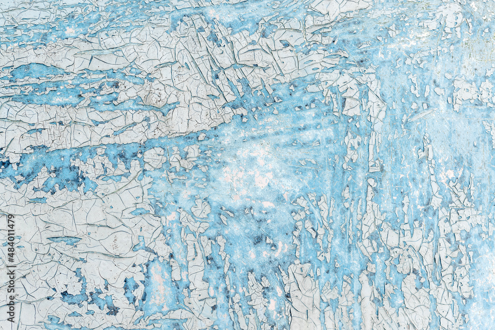 Fototapeta premium Crackle paint texture. Blue grunge pattern of natural enamel paint crackle. Cool texture of cracks, stains, scratches, splashes for print and design. Old painted concrete wall.