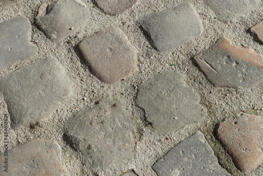 Background of cobblestone. Gray stone backdrop with cement joints. Background of cobblestone. Gray stone backdrop with cement joints.