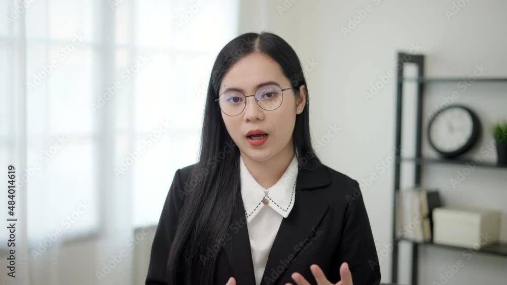 Business asian woman blogger vlogger influencer sit at home speaking looking at camera talking make video conference call record lifestyle blog vlog doing video chat at home concept, webcam view. Business asian woman blogger vlogger influencer sit at home speaking looking at camera talking make video conference call record lifestyle blog vlog doing video chat at home concept, webcam view.