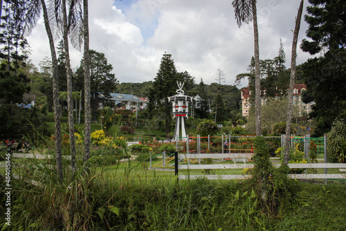 The Taman Pertabalan gardens with the vintage colonial era clock tower in the town of Tanah Rata in the Cameron Highlands.