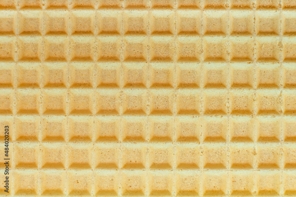 Wafers. Background of yellow waffles close-up. Pastry. Sweetness Wafers. Background of yellow waffles close-up. Pastry. Sweetness