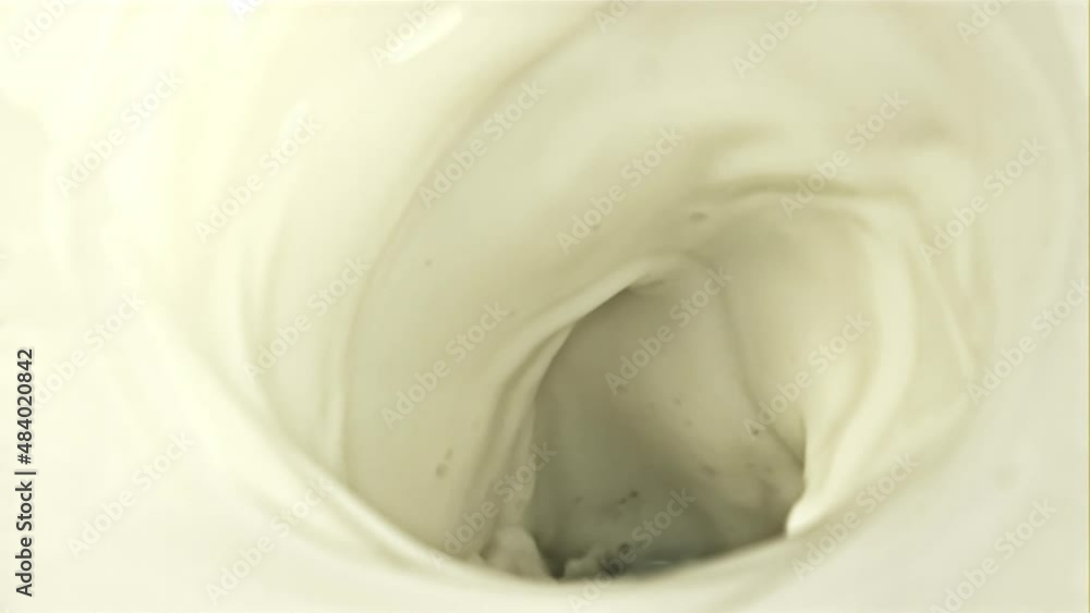 A whirlpool of fresh milk with air bubbles. Macro background. Filmed on a high-speed camera at 1000 fps. High quality FullHD footage A whirlpool of fresh milk with air bubbles. Macro background. Filmed on a high-speed camera at 1000 fps. High quality FullHD footage