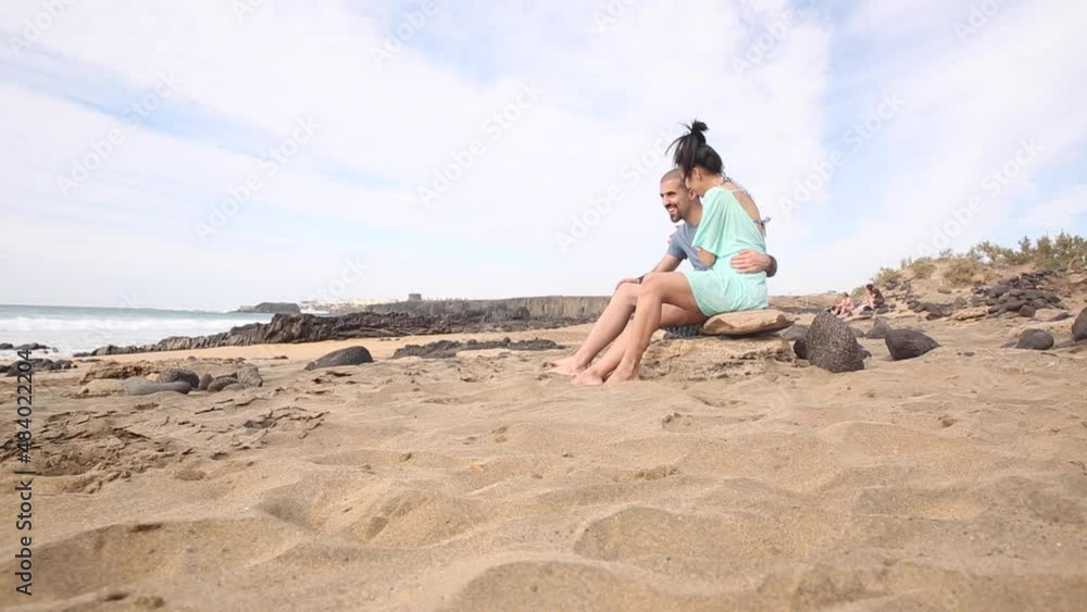 Authentic shot of a young couple in love spending time together at seaside Authentic shot of a young couple in love spending time together at seaside