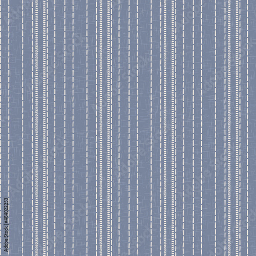 Seamless French country kitchen stripe fabric pattern print. Blue yellow white vertical striped background. Batik dye provence style rustic woven cottagecore textile. 