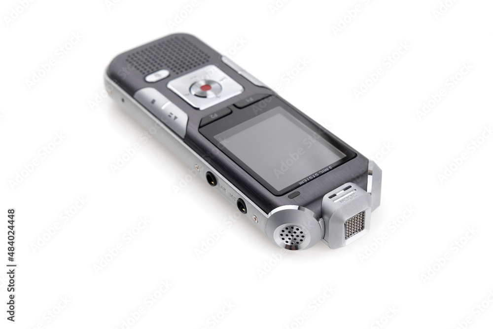 The voice recorder is isolated on a white background. Dictaphone close-up on a white background. The voice recorder is isolated on a white background. Dictaphone close-up on a white background.