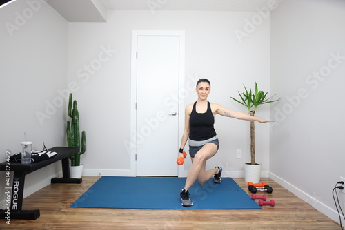 Fototapeta Naklejka Na Ścianę i Meble -  Woman Doing Dumbbell Exercise