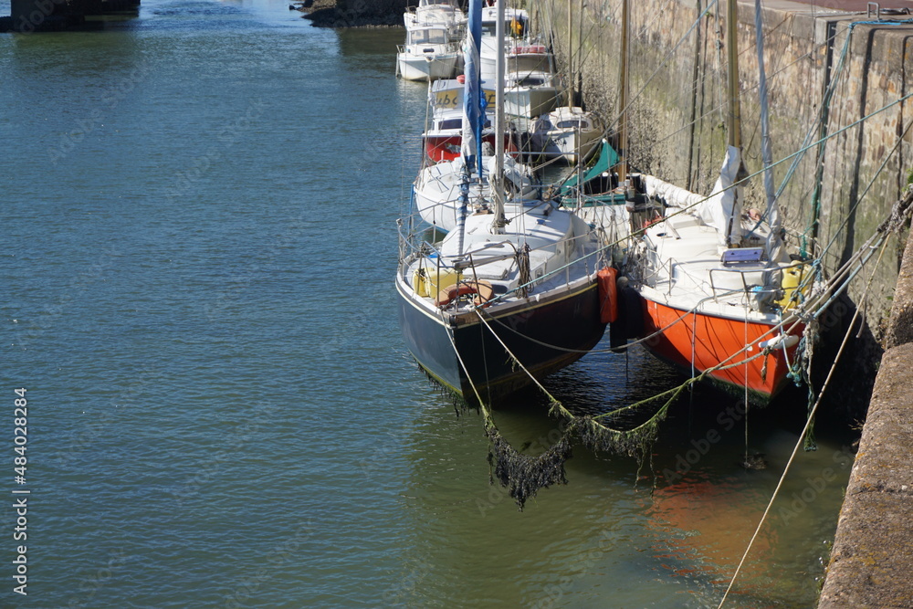 low tide on the boats in the harbor in vendée on the atlantic coast, france