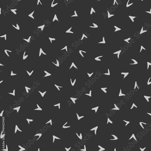 Seamless modern pattern with gray hand drawn arrows isolated on black background. Abstract monochrome illustration. 