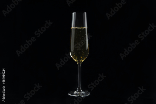 Champagne glasses on a black background.Alcoholic beverages.