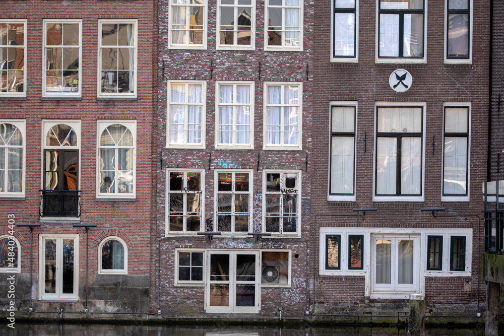 Windows Of Old Historical Houses At The Canal Around Damrak Amsterdam The Netherlands 28-1-2022