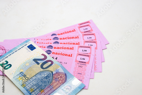 Close-up of a 20 euro bill on some national lottery tickets