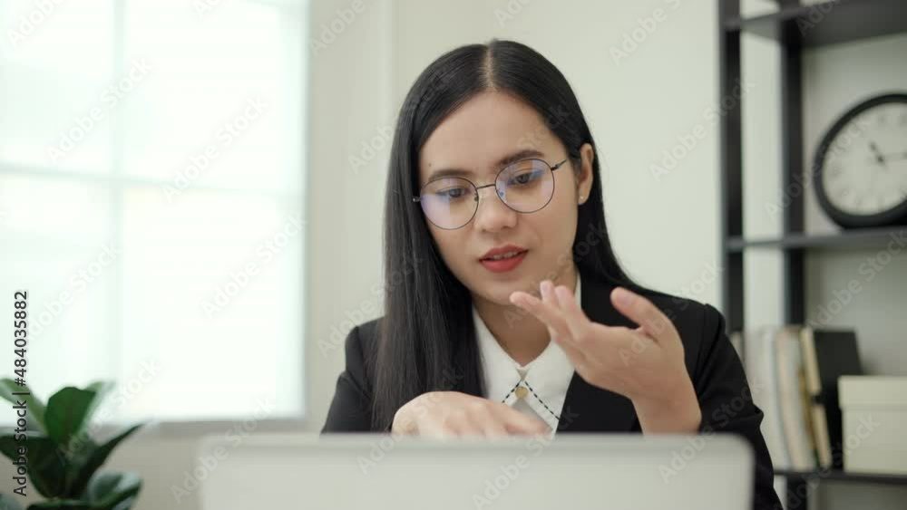 Close up smiley asian business woman video conference calling on computer talk by webcam in online chat, customer support service concept. Close up smiley asian business woman video conference calling on computer talk by webcam in online chat, customer support service concept.