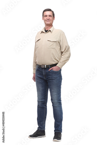 Full length portrait of a casual young man with hands in his pockets