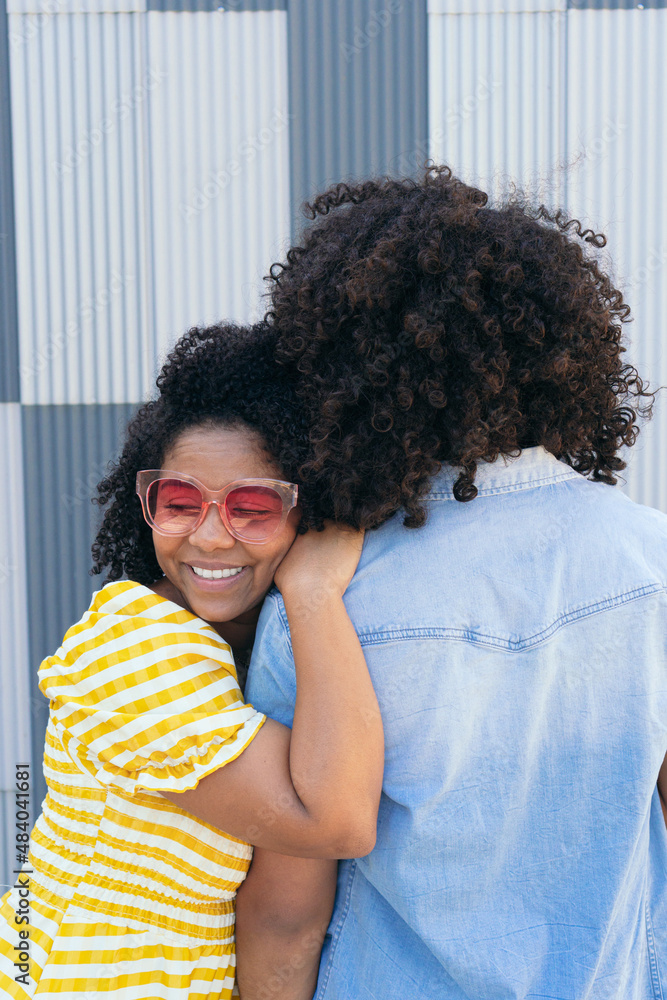 Smiling ethnic couple in bright sunglasses Smiling ethnic couple in bright sunglasses