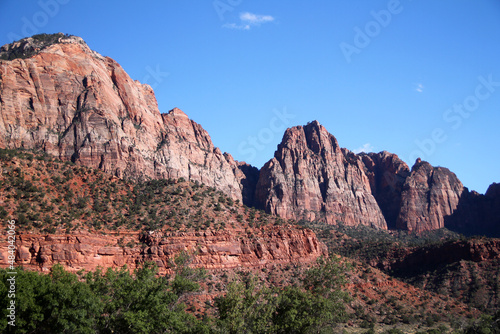 The shads of red painted on the ancient rock walls of Zion National Park © willeye