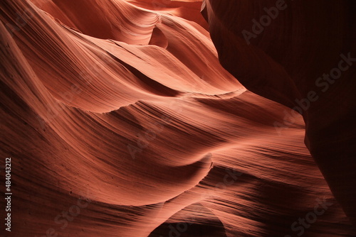 Bumps and dips on the walls of the red rocks of the Antelope Canyon