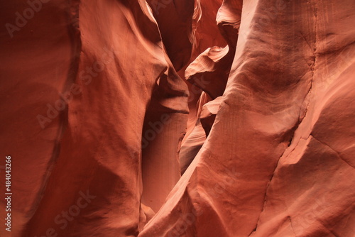 The narrow path surrounded by red walls in the Antelope Canyon