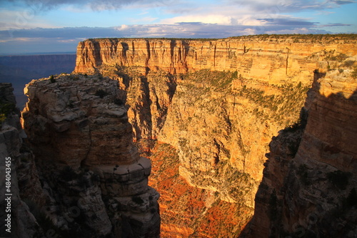 A stratification wall during a orange sunrise in the Grand Canyon National Park