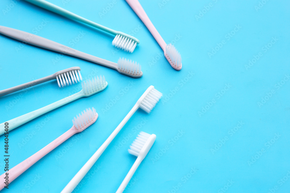 Toothbrushes on blue background. Top view Toothbrushes on blue background. Top view