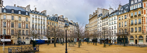 Panoramic view in autumn weather on the Place Dauphin on the island of Cité near Pont Neuf in the first district of Paris.