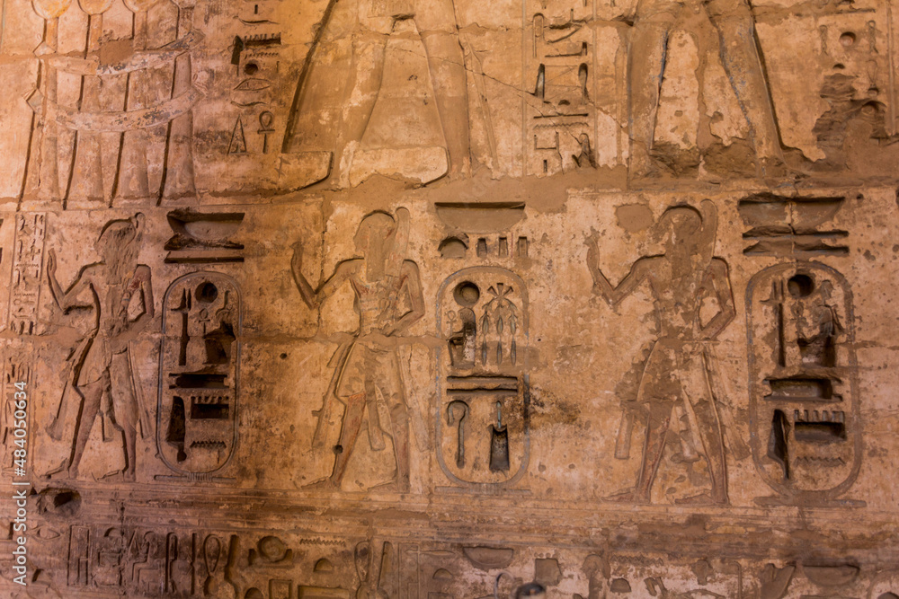 Naklejka premium Hieroglyphs in Medinet Habu (Mortuary temple of Ramesses III) at the Theban Necropolis, Egypt
