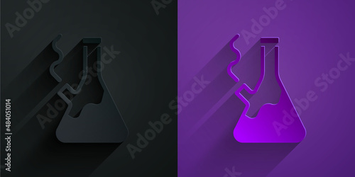 Paper cut Glass bong for smoking marijuana or cannabis icon isolated on black on purple background. Paper art style. Vector